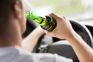 Guy drinking and driving